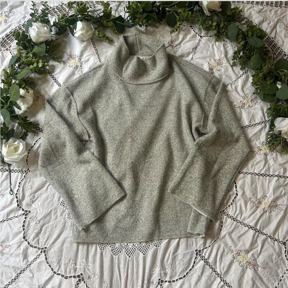 For The Republic grey turtleneck sweater with a relaxed fit and flare sleeves